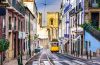 The yellow tram in the streets of Lisbon, Portugal