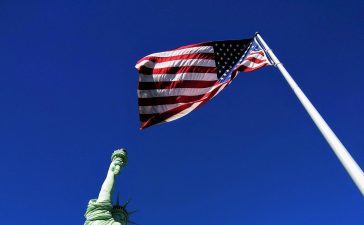 The flag of United States and statue of Freedom