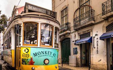 Tram in the street of Lisbon. Photo by Nextvoyage