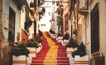 Spanish city small city scenery with Spanish flag on the stairways