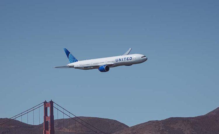 United Airlines aircraft flying over San Francisco, United States.