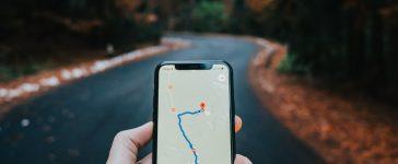 A tourist is using Google Maps while traveling