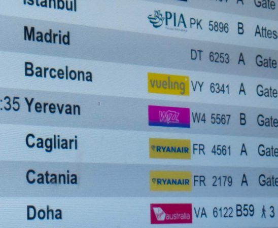 Timetable of the flight schedule in the airport. Barcelona flight is in the focus.