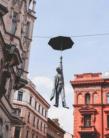 The airborne man hanging from the cables, Prague, Czechia.